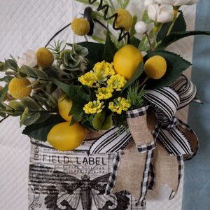 Tin can pocket with floral arrangement